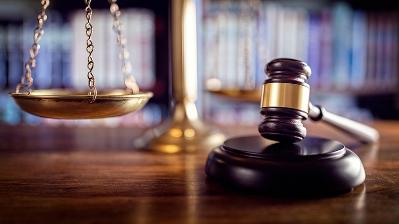 Gavel, scales, law books (Brian Jackson/Alamy Stock Photo)