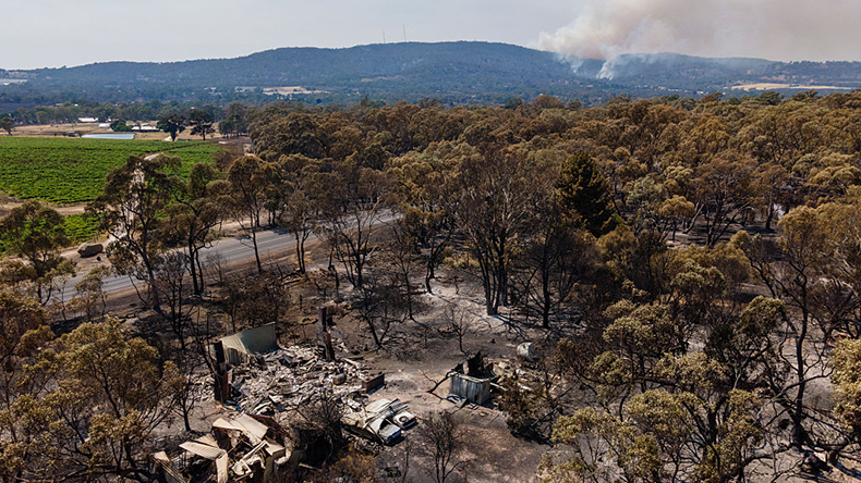 A burnt building lies ruined near Harcourt, Australia. Bushfires have burned tens of thou-sands of hectares in central Victoria, destroying multiple homes and other structures and forcing widespread evacuations under catastrophic fire conditions. 