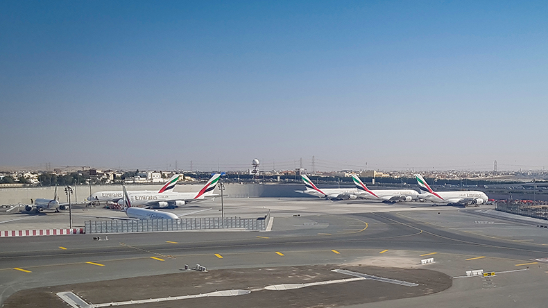 Dubai, United Arab Emirates View from the plane window, moments before landing, and Emirates Airbus A380s parked at Dubai International Airport         
