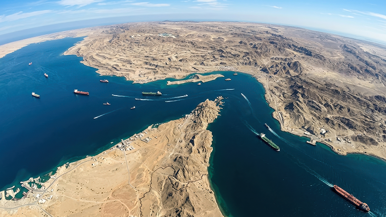 High angle satellite view of the Strait of Hormuz showing the strategic maritime chokepoint between Iran and Oman for global trade and logistics