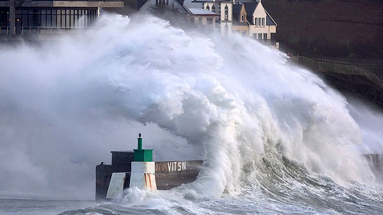 A huge wave crashes on the jetty of the harbour of Le Conquet, western France on January 8, 2026 as windstorm Goretti arrives.