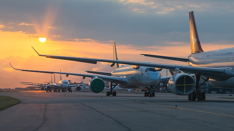 Aircraft are closely line up for long term parking at taxiway of airport