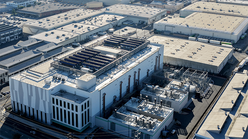 An aerial view of a 33 MW data center with closed-loop cooling system, amid warehouses on October 20, 2025 in Vernon, California