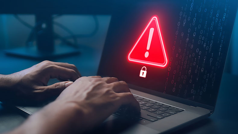 Cybersecurity threat warning appearing on a laptop screen