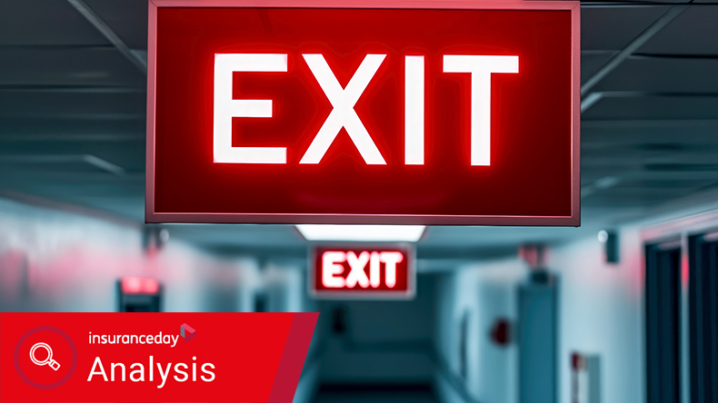 The Exit sign glowing in red shows the word EXIT to doorway.