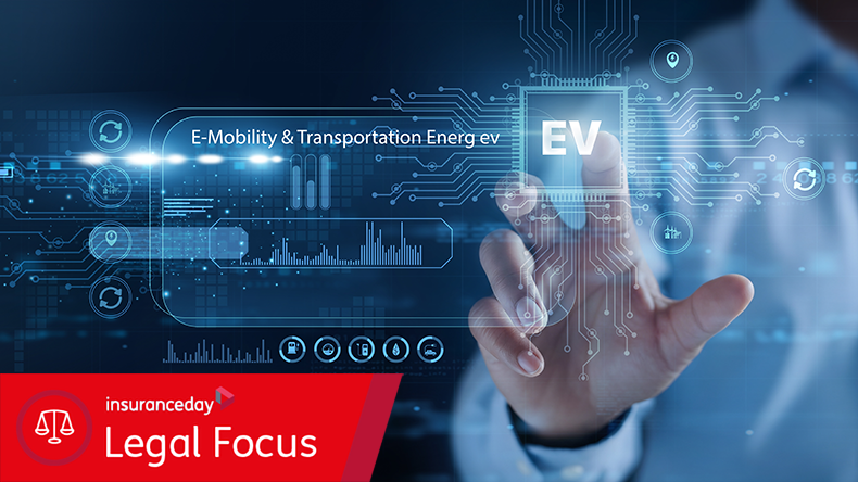 Engineer holding electric vehicle model. E-Mobility and transportation energy focus on EV vehicles, charging systems, and sustainable transport solutions.