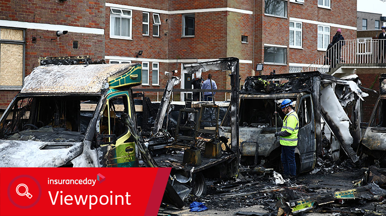 An official works among the burnt out ambulances at the scene of an antisemitic arson attack in the Golders Green neighbourhood of north London, on March 24, 2026, an incident where volunteer ambulances run by a Jewish organisation were set on fire the previous night.