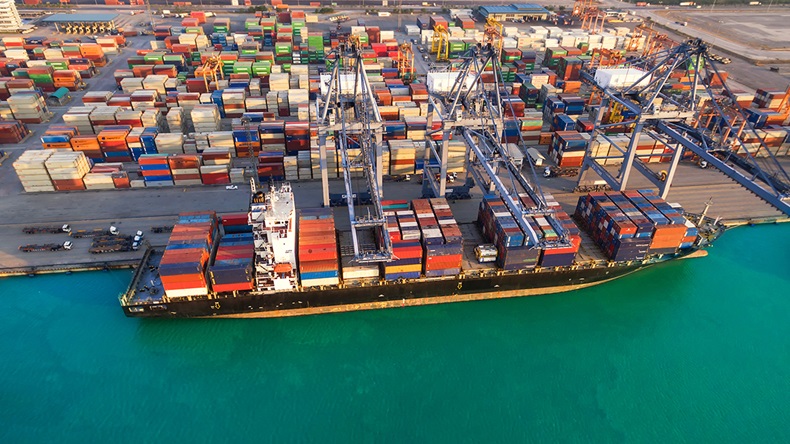 Cargo vessel loading (weerasak saeku/Shutterstock.com)