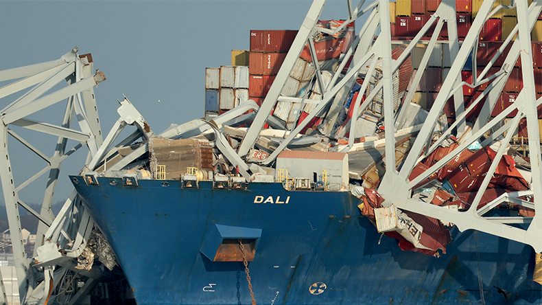 Collapsed remains of the Scott Key Bridge rest on the cargoship Dali on March 29, 2024 in Baltimore, Maryland