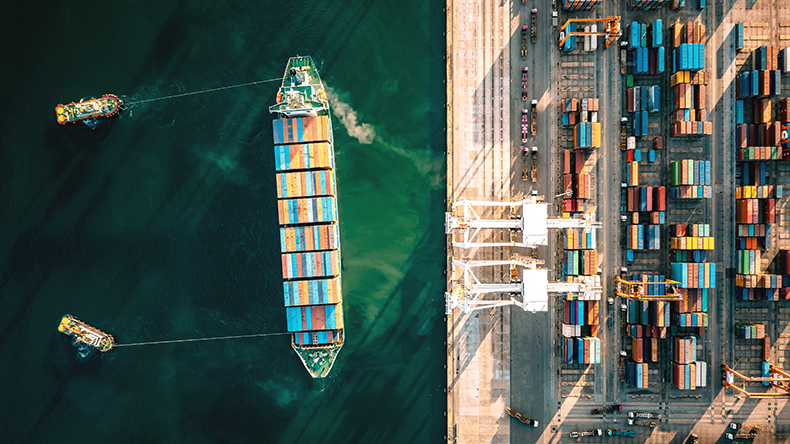 Containership preparing to be unloaded at port