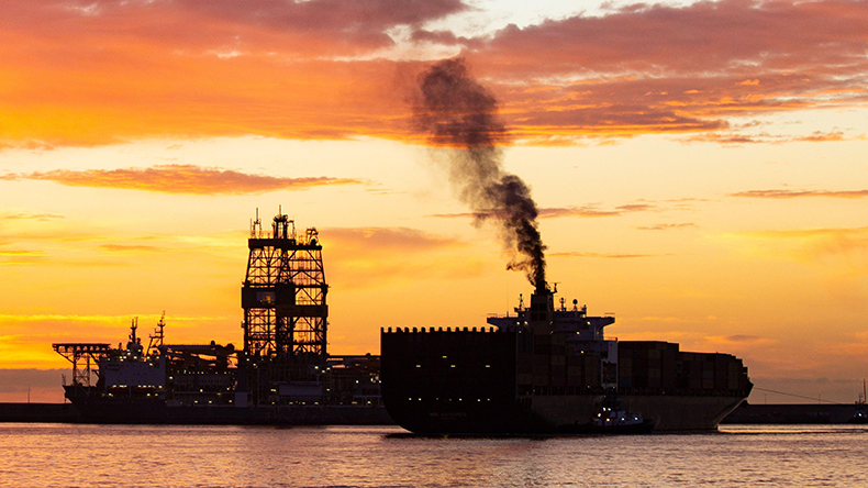 Smoke from funnel of a containership