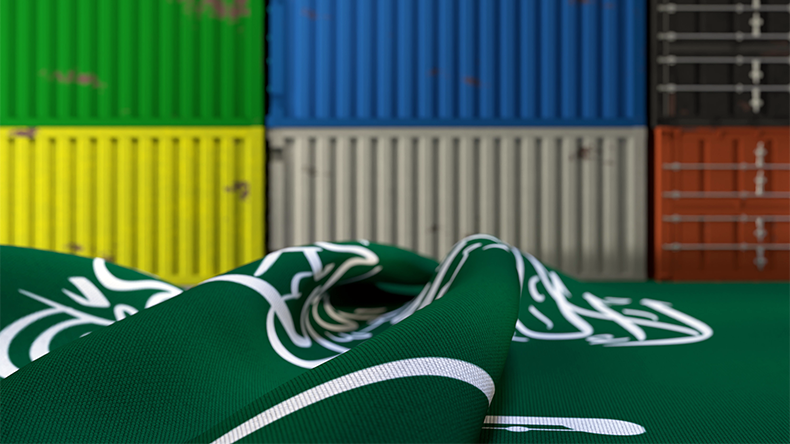 Wrinkled flag of Saudi Arabia and shipping containers