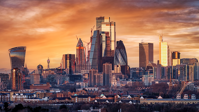 Elevated, panoramic sunrise view of the skyline of London City with the modern skyscrapers reflecting the soft morning sunlight