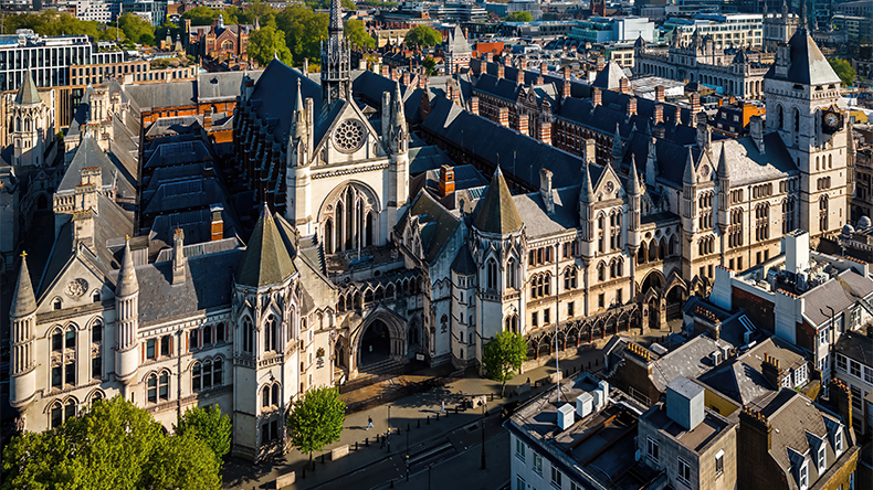 Aerial view of the historic Royal Courts of Justice in London's legal district on a clear day