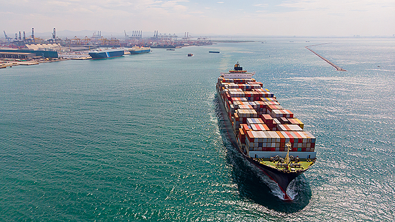 Containership leaving, aerial view.