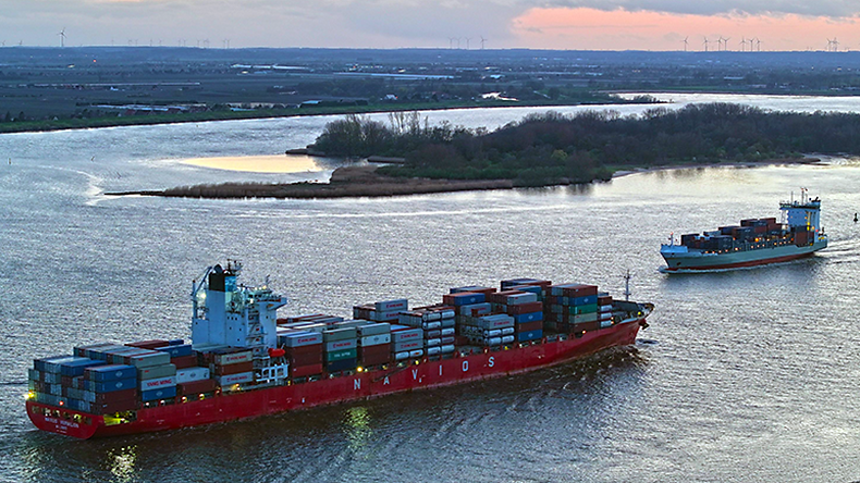 Containership and feeder ship on river Elbe