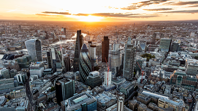 Aerial London sunset financial district city skyscrapers UK