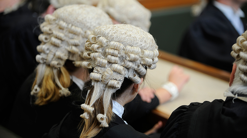 Law court in England with members of the bar wearing barristers’ wigs