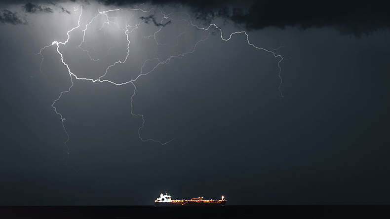 Lightning occurs when META 4, an Oil Products Tanker, sails into Muscat Anchorage on March 21, 2026 at Sultan Qaboos Port in Muscat, Oman.
