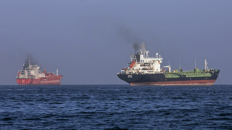 Tankers remain anchored on May 16, 2026 in the Strait of Hormuz near Larak Island, Iran