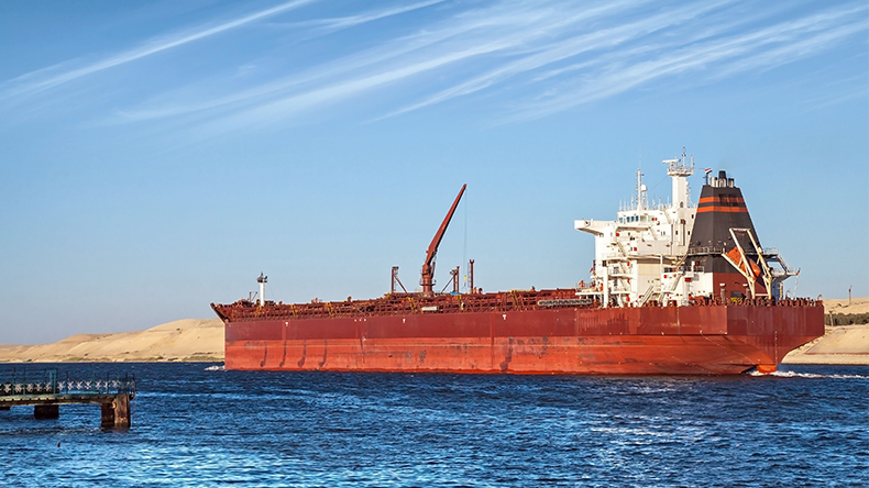 Big red oil tanker passes through the Suez Canal