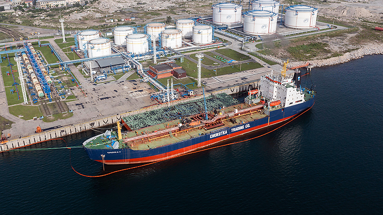 Top view of oil storage tank with a moored tanker at Nakhodka in Russia