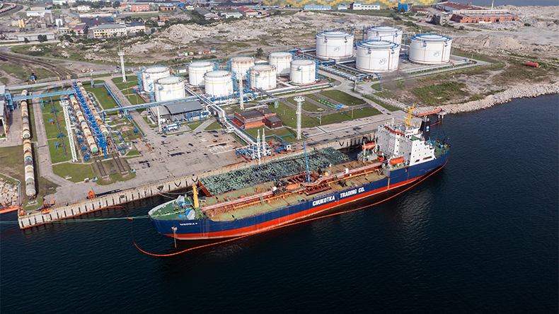 Top view on oil storage tanks with the tanker at a mooring at Nakhodka, Russia - July 31, 2022