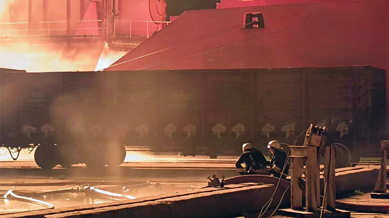 Odesa port with damaged equipment and fire